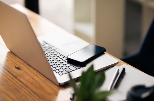 laptop and phone sitting on counter